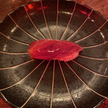 U Omakase - a piece of tuna on a black plate - Japanese Near Me - Brooklyn, New York U Omakase - a piece of tuna on a black plate - Japanese Near Me - Brooklyn, New York