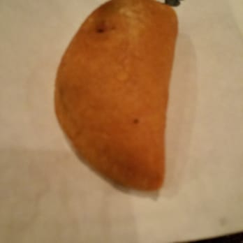 Empanada Mama - Hell's Kitchen - Beef empanada and I dipped in the green sauce....holy cow... - Latin American Near Me - New York, New York