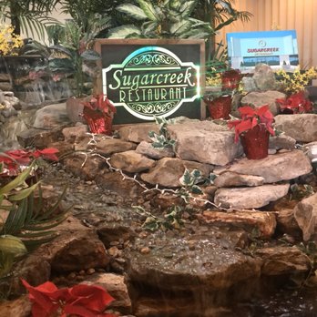 Sugarcreek Restaurant - Naturally unnatural middle of the restaurant water fountain. Makes a nice backdrop and the waterfall sounds are quite soothing. - American Near Me - Sheffield, Ohio Sugarcreek Restaurant - Naturally unnatural middle of the restaurant water fountain. Makes a nice backdrop and the waterfall sounds are quite soothing. - American Near Me - Sheffield, Ohio