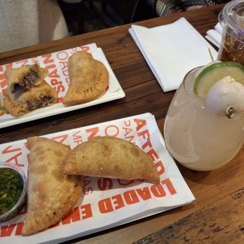 Loaded Empanadas - Renee N. had Philly Cheesesteak Empanadas (behind) - great flavor as well! My lychee sangria :P - Tapas/Small Plates Near Me - Las Vegas, Nevada