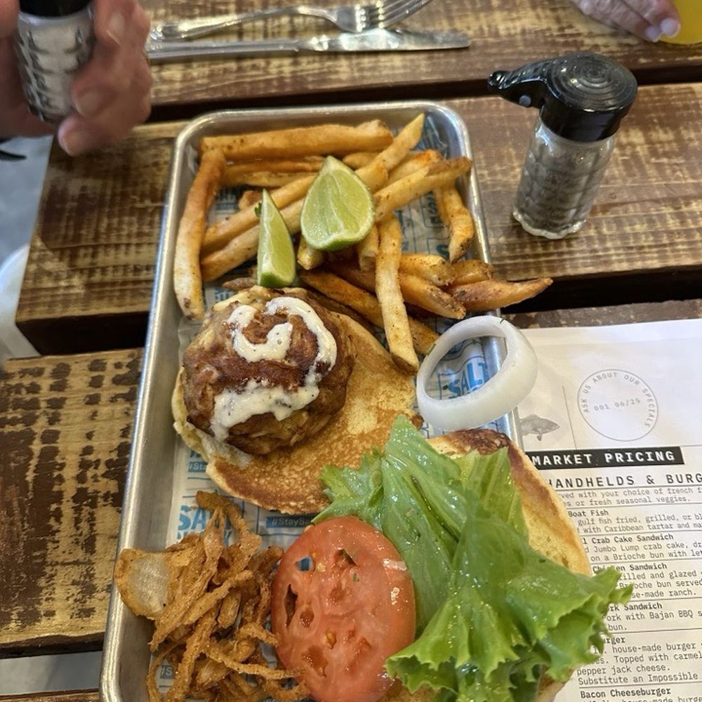 Salt Shack - Crabs cake sandwich with onion straws and fries - Seafood Near Me - Clermont, Florida Salt Shack - Crabs cake sandwich with onion straws and fries - Seafood Near Me - Clermont, Florida