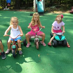 A Rising Star Children's Center - Riding our bikes in the playground!