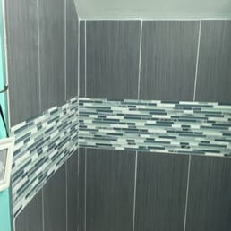 Glass Mosaic tiles with Ceramic tile walls.