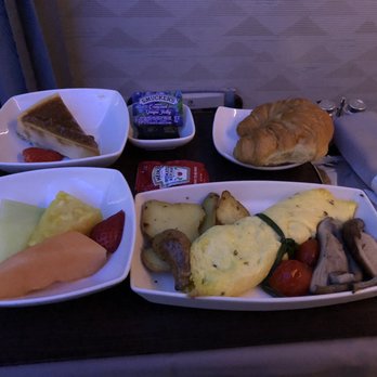 Hawaiian Airlines - Delicious gourmet caramel cheesecake, warm croissant with butter and jam, fruit salad with actual sweet fruit, kale omelet. - Airlines Near Me - Kahului, Hawaii