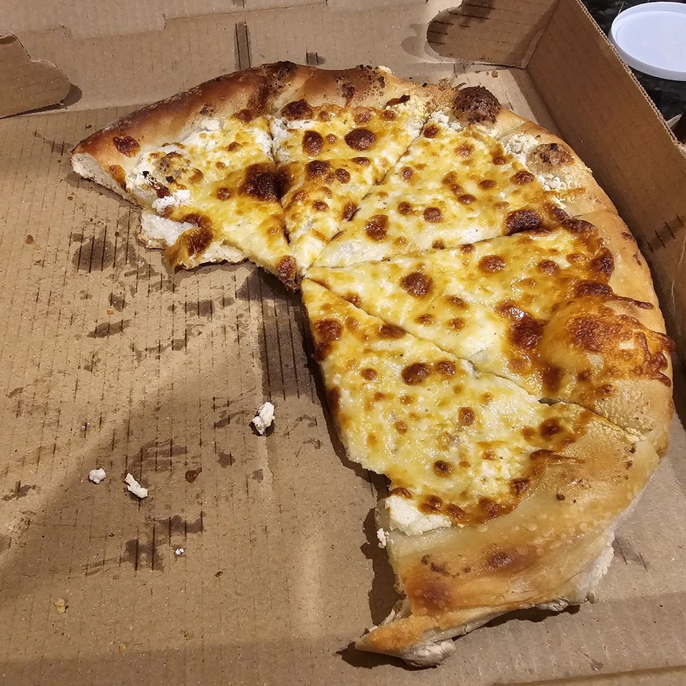 Kristopher's Pizza - a half eaten cheese pizza - Pizza Near Me - Poolesville, Maryland