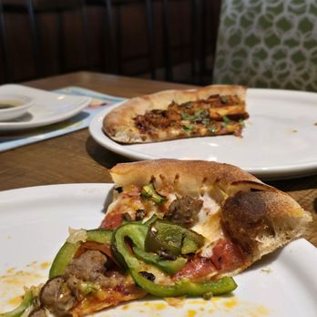 California Pizza Kitchen - A slice of The Works Pizza in the front - Pizza Near Me - Northbrook, Illinois