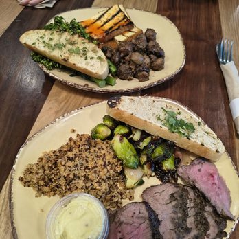 Urban Plates - Grilled steak with brussels sprouts, quinoa, and truffle aioli (bottom) + glazed tofu with sesame broccolini and mushrooms (top) - Salad Near Me - San Jose, California Urban Plates - Grilled steak with brussels sprouts, quinoa, and truffle aioli (bottom) + glazed tofu with sesame broccolini and mushrooms (top) - Salad Near Me - San Jose, California