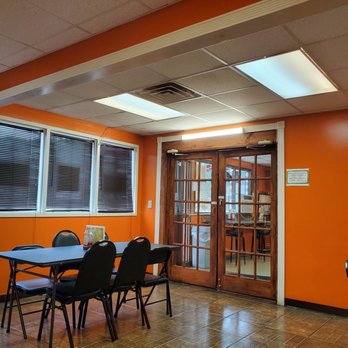 Jerusalem Restaurant - a dining room with orange walls - Halal Near Me - Peoria, Illinois
