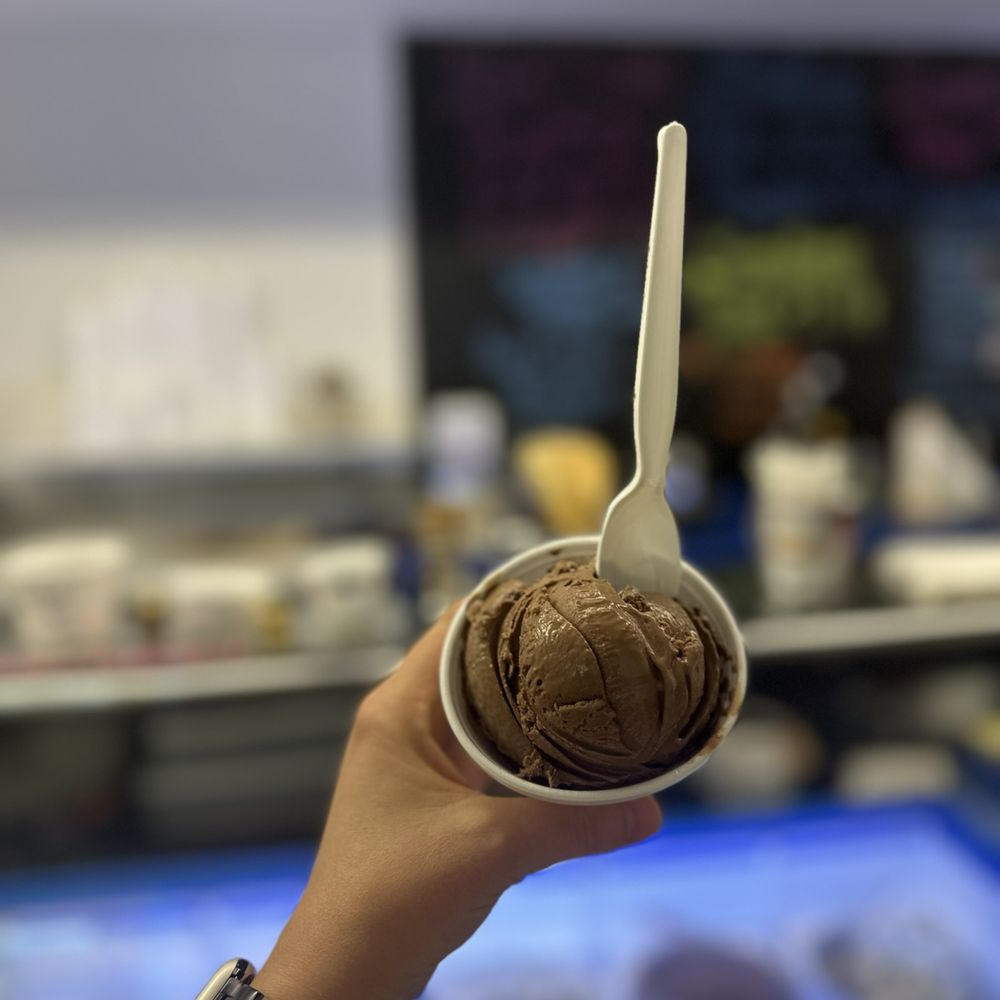Scoops Ice Cream - a person holding a spoon - Ice Cream & Frozen Yogurt Near Me - Mocksville, North Carolina Scoops Ice Cream - a person holding a spoon - Ice Cream & Frozen Yogurt Near Me - Mocksville, North Carolina