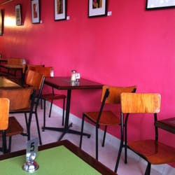 Starfish Bakery - Each month has a new local artist's work on the pink wall.
