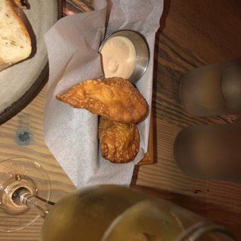 Lechon - Corn, cheese, and quinoa empanadas and champagne. - Tapas Bars Near Me - Portland, Oregon Lechon - Corn, cheese, and quinoa empanadas and champagne. - Tapas Bars Near Me - Portland, Oregon