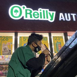 Staff changing my windshield wipers in the rain. Staff changing my windshield wipers in the rain.