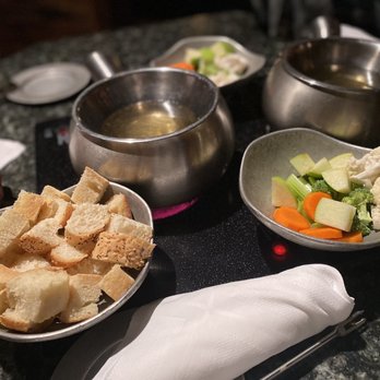 Simply Fondue - a variety of food items on a table - Fondue Near Me - Dallas, Texas