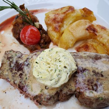 Restaurant Maison des Halles - Steak w/ herb butter and au gratin potatoes. - Hotels & Travel Near Me - Neuchâtel, Nebraska Restaurant Maison des Halles - Steak w/ herb butter and au gratin potatoes. - Hotels & Travel Near Me - Neuchâtel, Nebraska