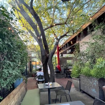 Windsor - Part of the patio in the back of restaurant. Very shaded with misters, a fireplace, and comfortable seating. - New American Near Me - Phoenix, Arizona Windsor - Part of the patio in the back of restaurant. Very shaded with misters, a fireplace, and comfortable seating. - New American Near Me - Phoenix, Arizona
