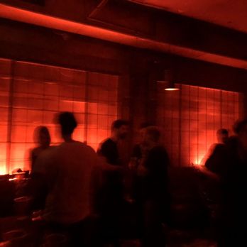Good Room - a group of people in a dimly lit room - Bars Near Me - Brooklyn, New York