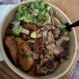 Chicken Over Jollof Rice with Fried Sweet Plantains & some mixed salad on the side Chicken Over Jollof Rice with Fried Sweet Plantains & some mixed salad on the side
