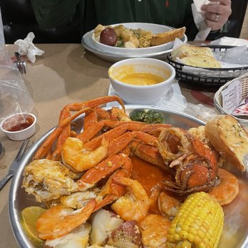 Flaming Crab Express Easton - a plate of crab legs, corn, potatoes, and corn on the cob - Cajun/Creole Near Me - Easton, Pennsylvania