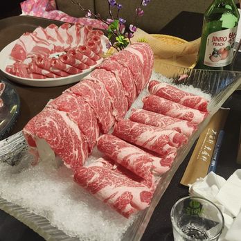 Happy Lamb Hot Pot - Left: lamb belly, top: aged lamb, center: wagyu - Mongolian Near Me - Bellevue, Washington Happy Lamb Hot Pot - Left: lamb belly, top: aged lamb, center: wagyu - Mongolian Near Me - Bellevue, Washington
