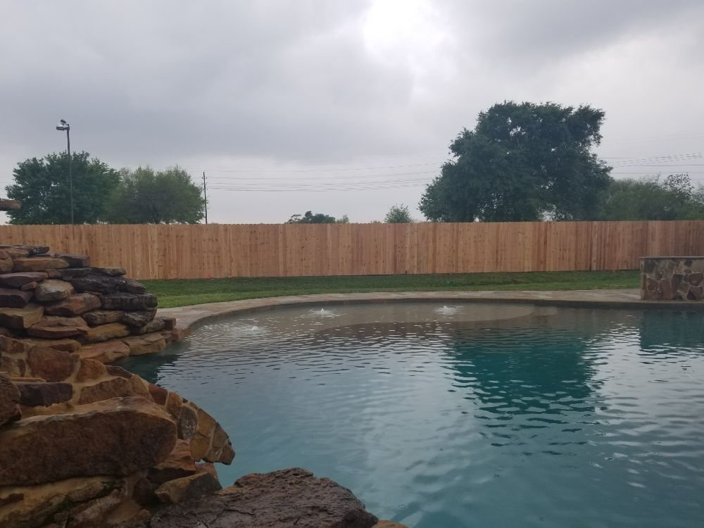 Slide of Pride of Texas Roof and Fence