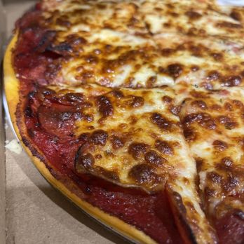 Deno’s Pizza - a cheese pizza in a box - Pizza Near Me - Surprise, Arizona
