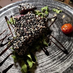 Osteria Toscanelli - Seared tuna with sesame.  Picture doesn't do it justice- seared on outside and pink and tender