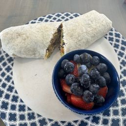 Chicken, potato, avocado burrito with a side of fresh fruit