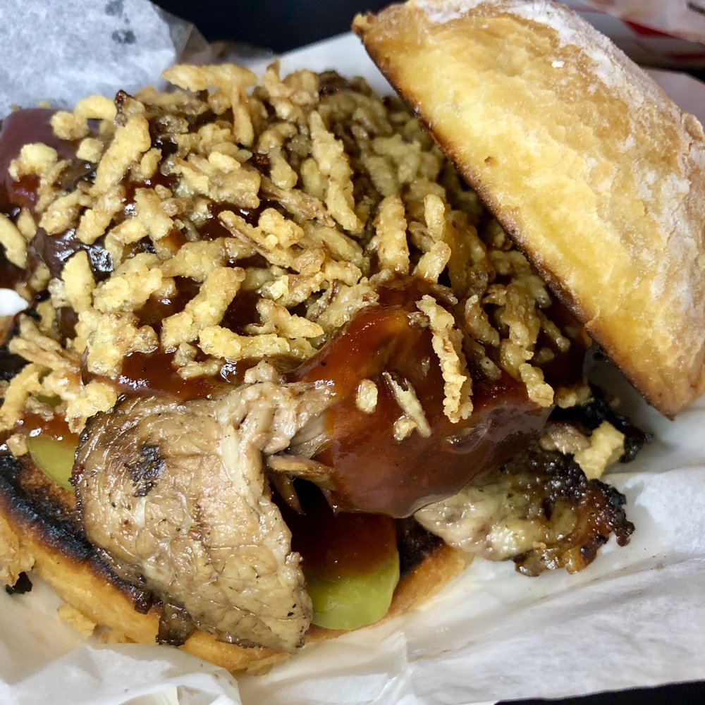 H3SH3R BBQ - BBQ beyond driven sandwich - brisket, pickles, bat outta hell sauce, and fried onions - Food Trucks Near Me