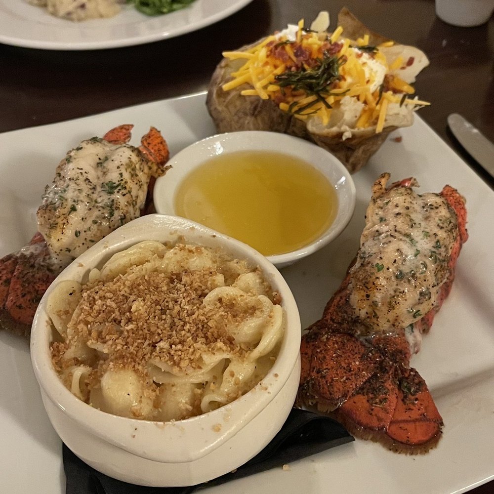 Meritage - Twin Lobster Tails in the forefront. Filet Mignon in the background. - New American Near Me - Cincinnati, Ohio
