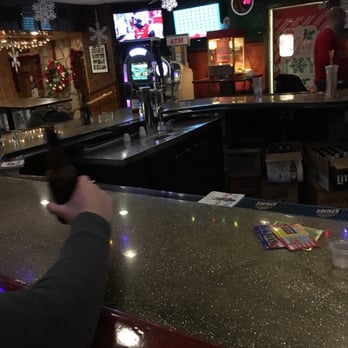 Bases Loaded - a man sitting at a bar - Bars Near Me - Buffalo, New York