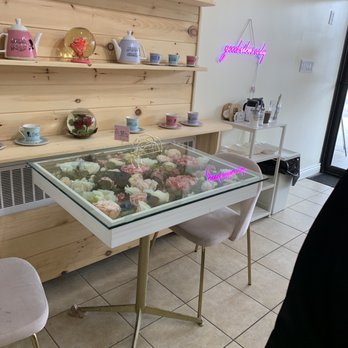 Rose Cafe - a glass table with flowers on it - Middle Eastern Near Me - Kitchener, Ontario