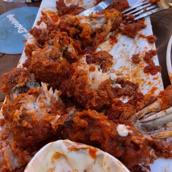 Rendezvous Bar & Grill - What's left of the bad chicken wings. Breaded and sauced so bad they are terrible. - American Near Me - Tillamook, Oregon