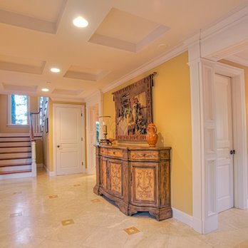 DoBel Construction - a foyer with marble floors and yellow walls - General Contractors Near Me - San Carlos, California