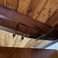 Meredith Lodging Sunriver - One of the mail support beams held together by 2 "U" and 1 "C" clamps.  Wow! Hope it holds!