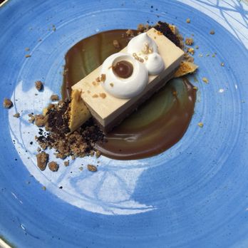 Murrieta's West Coast Bar & Grill - Salted caramel cheesecake with dark chocolate and sponge toffee - Wine Bars Near Me - Calgary, Alberta Murrieta's West Coast Bar & Grill - Salted caramel cheesecake with dark chocolate and sponge toffee - Wine Bars Near Me - Calgary, Alberta