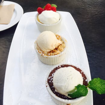 Yard House - Dessert trio- so good!! Chocolate soufflé, peach cobbler and lemon soufflé - New American Near Me - Springfield, Virginia Yard House - Dessert trio- so good!! Chocolate soufflé, peach cobbler and lemon soufflé - New American Near Me - Springfield, Virginia