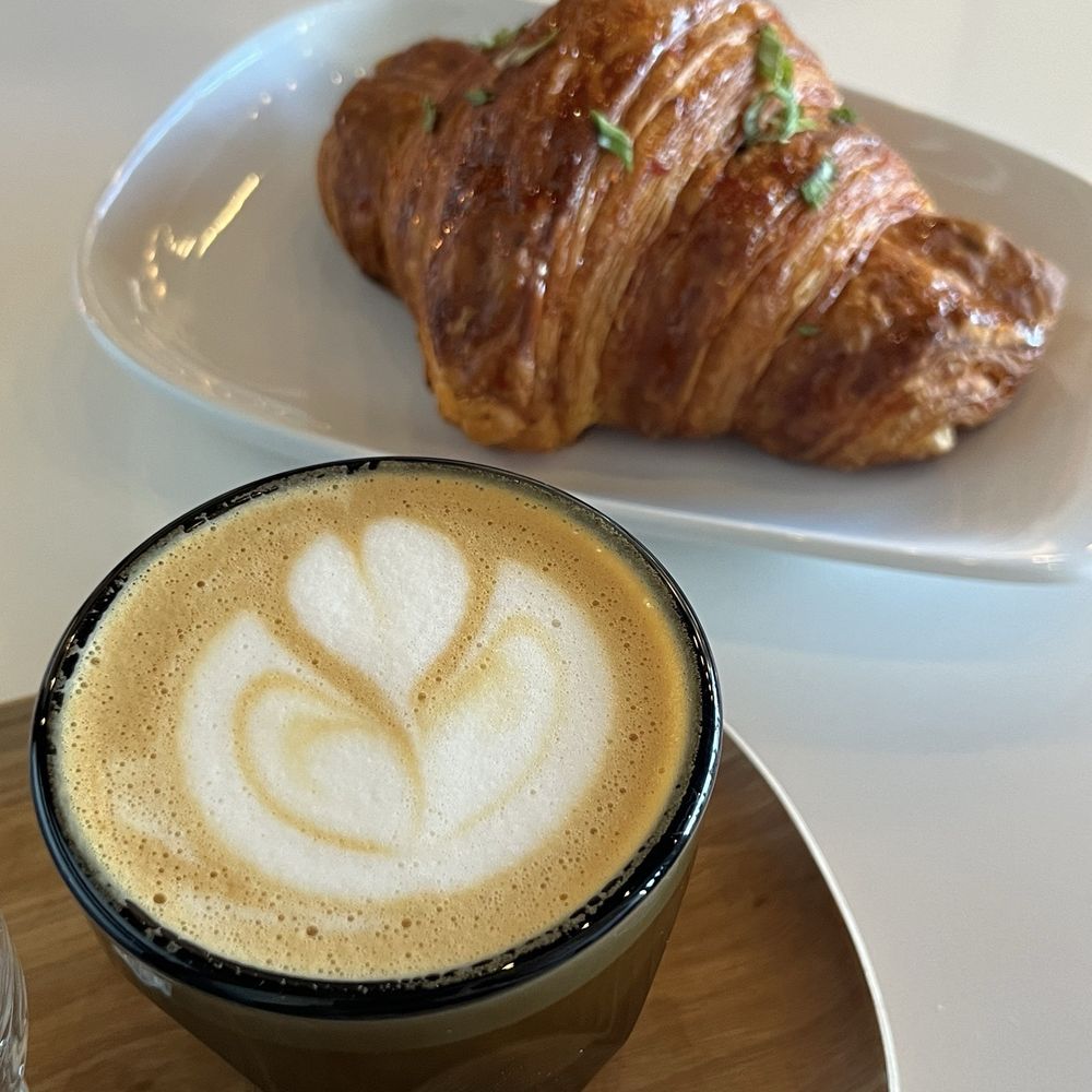 Sweet Bloom Coffee Roasters - oatmilk cortado, gochujang croissant - Coffee & Tea Near Me - Westminster, Colorado Sweet Bloom Coffee Roasters - oatmilk cortado, gochujang croissant - Coffee & Tea Near Me - Westminster, Colorado