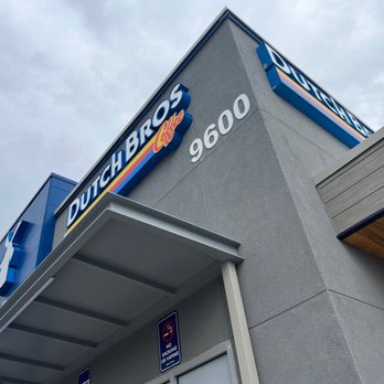 Dutch Bros Coffee - A photo of a Dutch Bros Coffee storefront showing the building's corner, signage, and part of the exterior architecture. - Coffee & Tea Near Me - Albuquerque, New Mexico