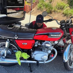 Adriano taking care of the old bike! Adriano taking care of the old bike!