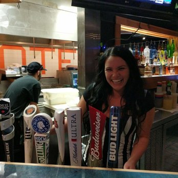 Hooters - Bartender and kitchen staff in background - Chicken Wings Near Me - Hampton, Virginia Hooters - Bartender and kitchen staff in background - Chicken Wings Near Me - Hampton, Virginia