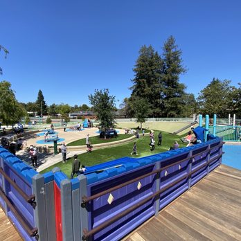 Magical Bridge Playground - View from the top: slides, grassy slopes and other play structures. - Parks Near Me - Sunnyvale, California Magical Bridge Playground - View from the top: slides, grassy slopes and other play structures. - Parks Near Me - Sunnyvale, California
