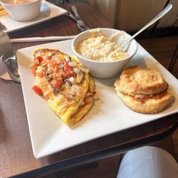 Kountry Kafe - Vegetable omelet with salsa on top with a biscuit and cheese grits