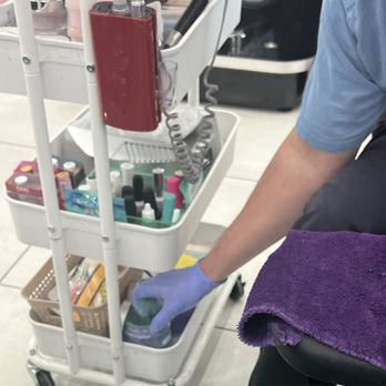 Nails 19 - Technician reaching into the sugar scrub jar with the same gloved hands that he just used to remove my polish and manicure my toes. - Nail Salons Near Me - Roseville, California