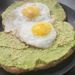 Toast Cafe - Avacodo toast with perfectly cooked eggs.