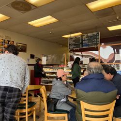 Marina Donuts & Bagels - Busy inside. Line starts at end