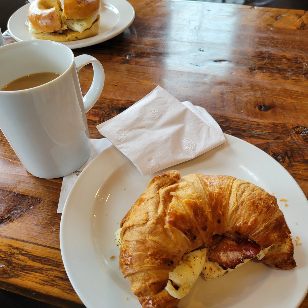 The Blue - a croissant sandwich and a cup of coffee - Coffee & Tea Near Me - Kennebunk, Maine The Blue - a croissant sandwich and a cup of coffee - Coffee & Tea Near Me - Kennebunk, Maine