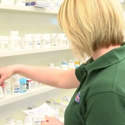 Cody's USave Pharmacy - Sam retrieving medication from the shelf.