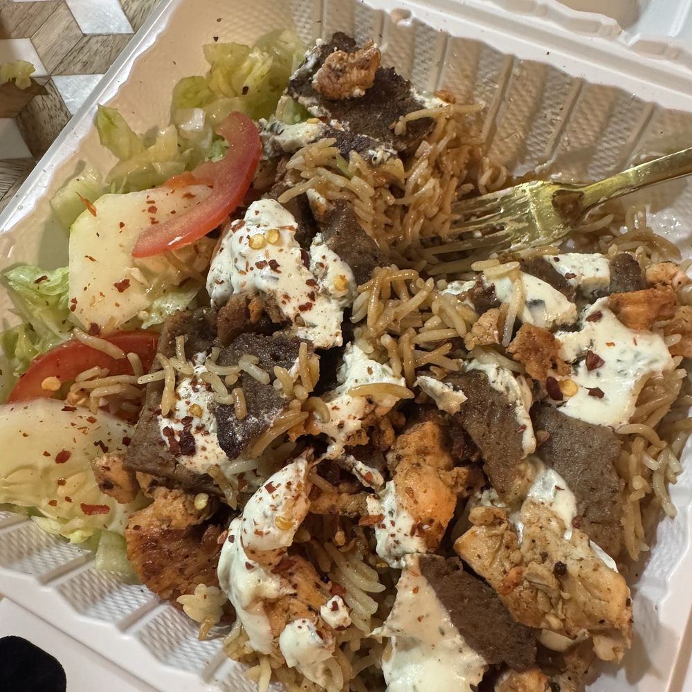 Lamb and chicken over rice with salad Lamb and chicken over rice with salad