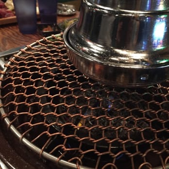 Jongro BBQ - The charcoal underneath the grill - Korean Near Me - New York, New York