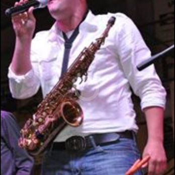 Mary's Lounge - a man playing a saxophone and singing into a microphone - Lounges Near Me - Lake Charles, Louisiana Mary's Lounge - a man playing a saxophone and singing into a microphone - Lounges Near Me - Lake Charles, Louisiana